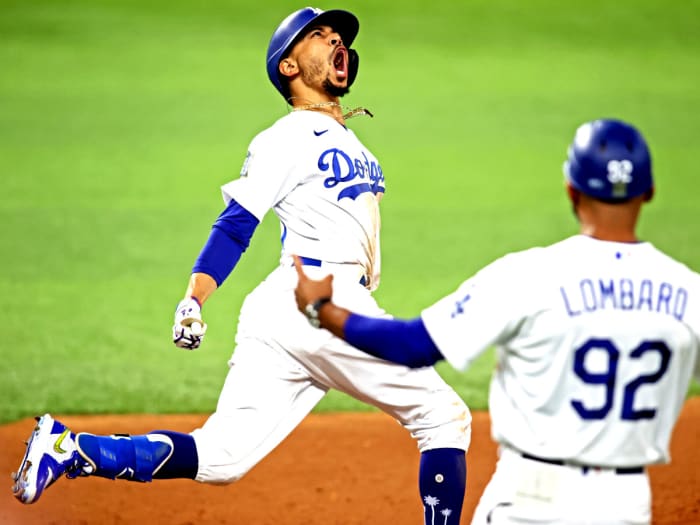 Oct 27, 2020; Arlington, Texas, USA; Los Angeles Dodgers right fielder Mookie Betts (50) celebrates after hitting a home run during the eighth inning against the Tampa Bay Rays during game six of the 2020 World Series at Globe Life Field.